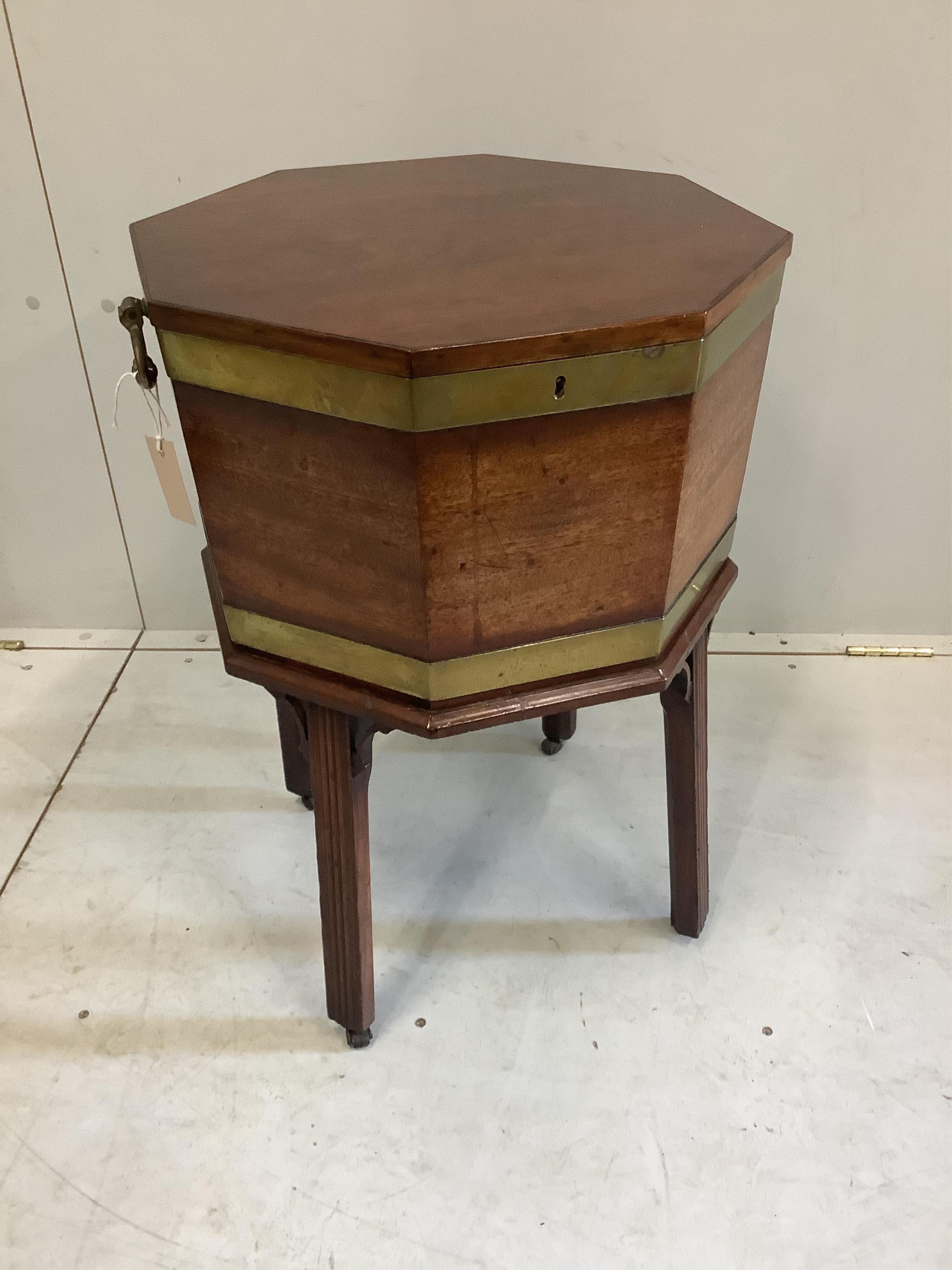 A George III and later mahogany brass bound octagonal wine cooler, width 50cm, height 63cm. Condition - good